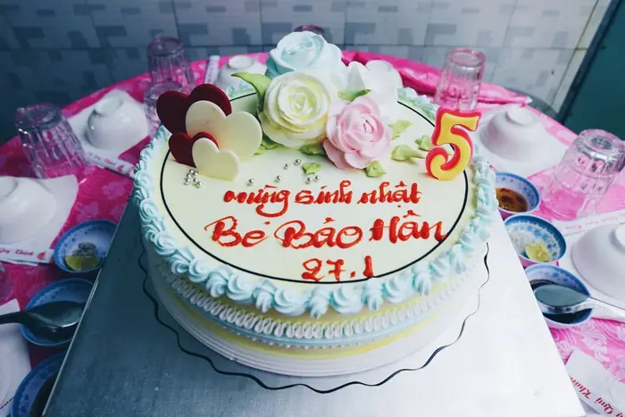 Celebration cake with berries and floral frosting